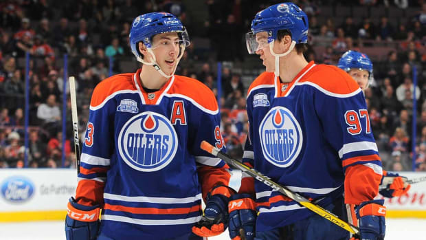 Nugent-Hopkins-McDavid-Andy-Devlin.jpg